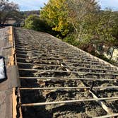 Photos by Tmk Innovations LLC #2 Stripped the roof and roof sheathing down to trusses and replaced all sheathing and shingled the roof