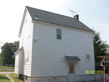 Brilliant Painting, LLC Exterior Project 1 Before and after photos of a full house that has been power washed, scraped, hand sanded, primed, and painte