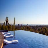 Photos by Aquatic Technology #2 Elevated hillside vanishing edge pool, spa, swim up bar, water feature, fire feature