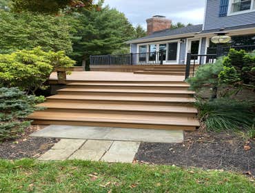 Photos by Dwell Renovations LLC #6 TREX Havana Gold with black aluminum railings