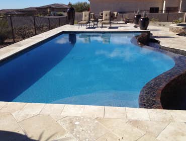 Reverse negative edge Travertine deck, spa, reverse negative edge play pool,