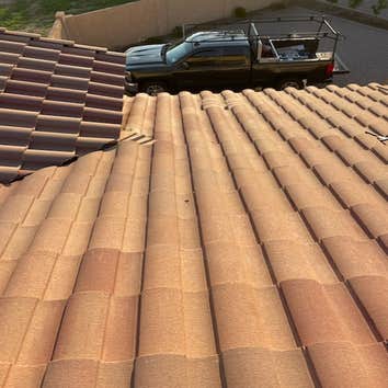 Photos by Jilek Roofing #1 Removed tiles above roof leak area. Replace roof tile underlayment and replace roof tile.