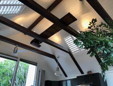 Shiplap ceiling with decorative beam install