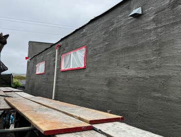 Photos by Santiago's Bay Builders Inc #1 Remodeling half of the building