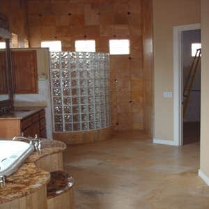 Shower Remodel Customer had an existing slate shower and tub surround. We tore it all out and installed a new travertine shower chaning the shape...