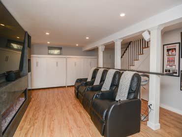BASEMENT? MORE LIKE AN OASIS Nestled in Belmont, another captivating project unfolds. Our client envisioned their basement as a serene retreat and an e