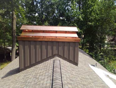 Photos by Kwaske Construction Co #2 Enclose and properly flash stone chimney
Fabricate custom copper chimney cap
Raise roof deck for proper ventilation