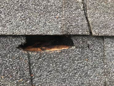 Hole in roof caused by high winds