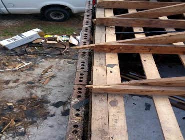 Photos by Service Restoration Pros LLC #1 A tree fell through the roof of this 3 bedroom house during Hurricane Ida. It left several gaping holes and a