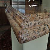 Kitchen countertops KItchen countertops, raised bar, and backsplash. Materials used are from Arizona tile: Juparana Florence Granite on countertops, ba