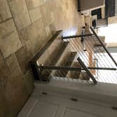 Photos by Brainz & Brawn Structures Inc #1 Stainless Steel bar handrail.. multi-tier stainless railing for interior staircase and basement access.