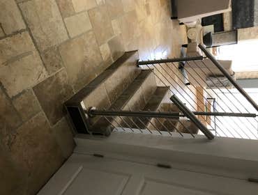 Photos by Brainz & Brawn Structures Inc #1 Stainless Steel bar handrail.. multi-tier stainless railing for interior staircase and basement access.