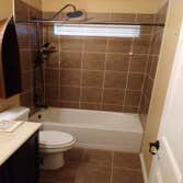 Photos by Vip Services #2 Demos existing tub/shower and convert into handicap bathroom. Created and built an sink and cabinet to go with the rustic des