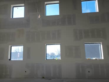 Photos by Crazy Kings Construction #1 30 foot tall walls framed and drywalled by us