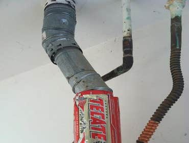 Project photos from Echols Home Inspections Old Knob n Tube wiring.
Damaged Electrical Panel
Slight Water Intrusion
Beer Can Hot Water Heater Flue (N