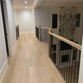 Photos by General Hardwood Flooring Inc #1 White oak 5”x3/4 installed, sanded and refinished with custom stain color