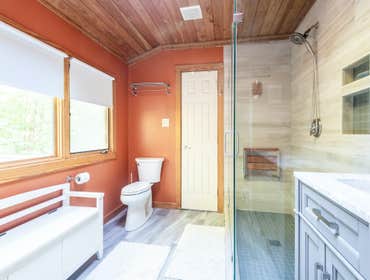 Bathroom in Ballard We were tasked to make the bathroom feel lighter and more spacious. We preserved some original elements of the bathroom, the ceilin