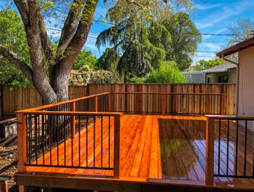 Redwood Deck with wrought-iron fence
