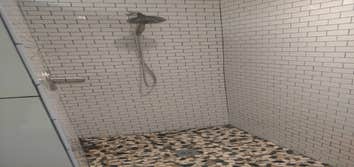 Photos by Dutch Dynasty Construction Relocate tub, walk in shower with no door, new vanity, ventilation fans, recessed lights, replace arch entry with 