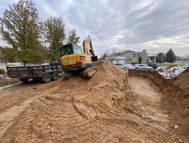 Photos by Asap Inc Replacement Septic System, Trenches being dug out.