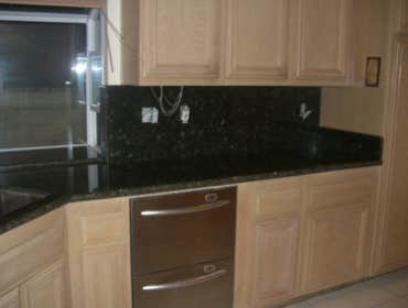 Kitchen Remodeling in H.B. Ca We replaced the Kitchen tiles , also put new granite counter tops and bathroom counter tops.
