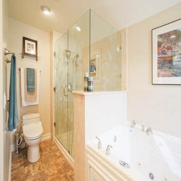 Master Bathroom This bathroom was completely gutted. We installed a large Trajet jetted bathtub, oversized shower, custom vanity, recessed lighting, n