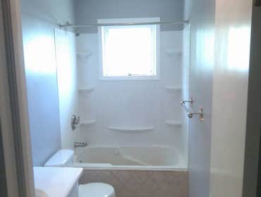 bathroom remodel demo in bathroom,new drywall,tile floors and tub face,new tub surround,new electrical,plumbing,all new fixtures and new trim.