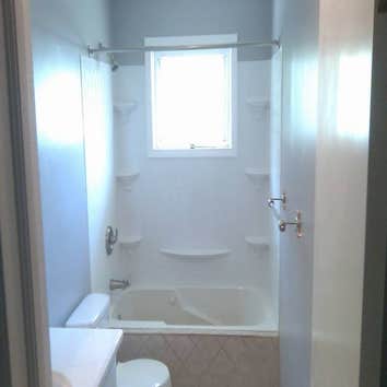 bathroom remodel demo in bathroom,new drywall,tile floors and tub face,new tub surround,new electrical,plumbing,all new fixtures and new trim.