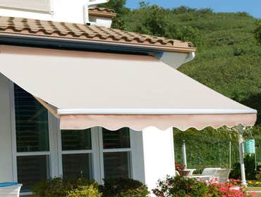 Electric Retractable Canvas Awning This retractable awning is a beautiful way to provide shade to your home.