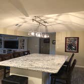 Residential renovation Renovation of existing kitchen and dining space to create an open floor plan with new dining island, wine/bar area and kitchen 