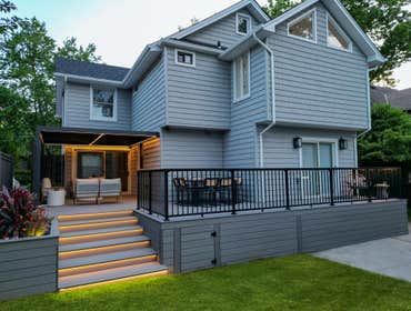 Bayside Deck and Patio Remodel Experience luxury in your own backyard with this transformation in Bayside, featuring a spacious deck, cozy covered seat