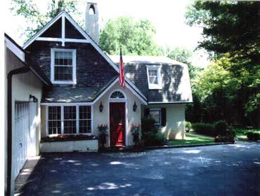 Victorian Addition This late 1880’s estate caretaker’s house has a wing that houses the kitchen and a small family room and a 1980’s “French Provincial