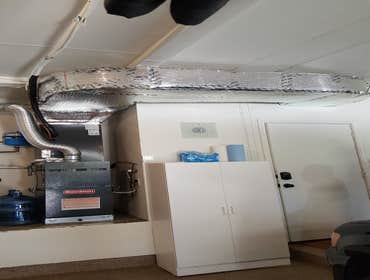 Photos by Air Breeze Inc #14 The first image is a furnace & coil while the second is a rooftop package unit.