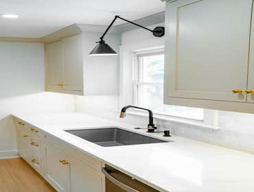Photos by Albrecht, LLC #1 Through strategic space planning, thoughtful material selections, and custom craftsmanship, this first-floor renovation tran