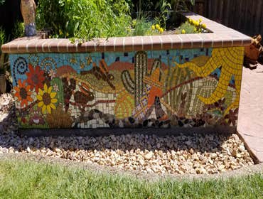 Backyard planter with a Custom made tile Tiles made by homeowner from various ceramics