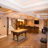 Deluxe Kitchen in Basement remodel with crawford ceilings, hidden doors, stone and granite bar, and living area. Deluxe Kitchen in Basement remodel wit