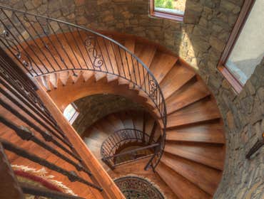 Custom Home with Inspiring Views DESCRIPTION
This home melds rich materials with soft, arching lines— resulting in an elegant but cozy feel throughout