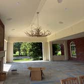 Lambton Park Road, New Albany Addition of an attached, covered porch with concealed retractable screens. Full bluestone floor, limestone fireplace surr