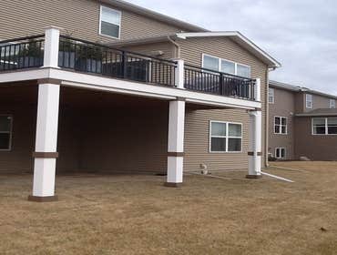 Photos by Custom Home Specialties Inc #2 Timber Tech maintenance free decks with powder coated railings.