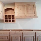Custom built vent-a-hood, wine rack, and media shelf
