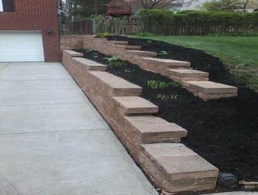 Project photos from Hollis Contracting Tore down an existing retaining wall and rebuilt the wall another level. Another addition that we added was the 