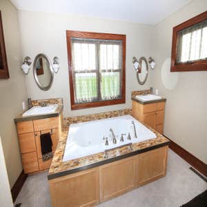 Photos from Chucks Carpentry LLC Installation of sink & tub glass tile work.
