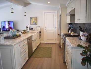 Costa Mesa Home Refurbished home in Costa Mesa was updated with new Maple Cabinets, wood flooring, new counters, lighting and subway tile.