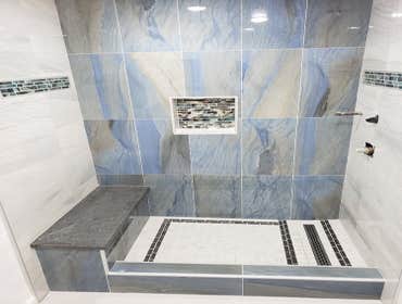Bathroom Remodels At Rudy's Construction, we specialize in high-quality bathroom remodels that enhance both the style and functionality of your home. F
