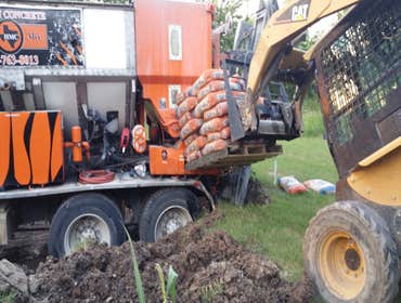 Loading metered concrete truck