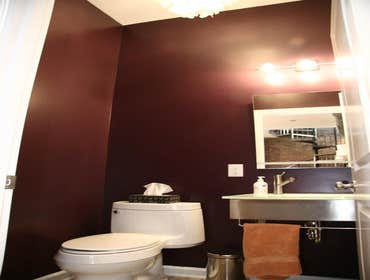 South 12th Street Luxury Apartment The mix of original brick, cold steel and smooth lavender walls add up to just the right amount of texture in this c