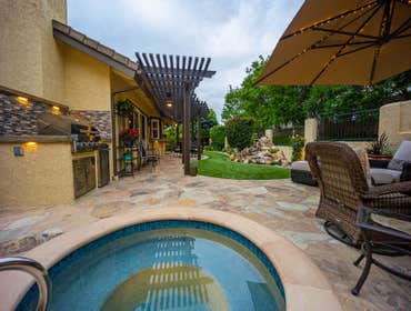 backyard with spa, Brea new in ground spa, custom aluminum patio over, turf, landscaping, flagstones, custom water feature