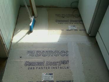 Photo(s) from Laur Moor Construction Two decks and a tiled kitchen floor