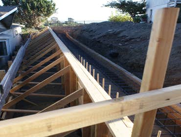 K Morales Construction Project interior remodels of bathrooms
Retaining wall on side of hill
Dual headed custom built shower