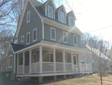 Photos by Muddy River Building Company LLC #2 Originally a small ranch, a second and third floor were added. A large covered front porch and back yard